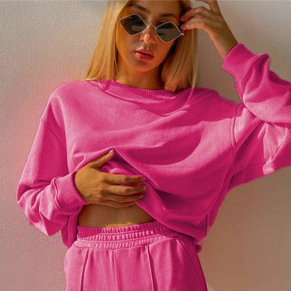 Fuchsia sweater met ronde hals en elastische tailleband, close-up