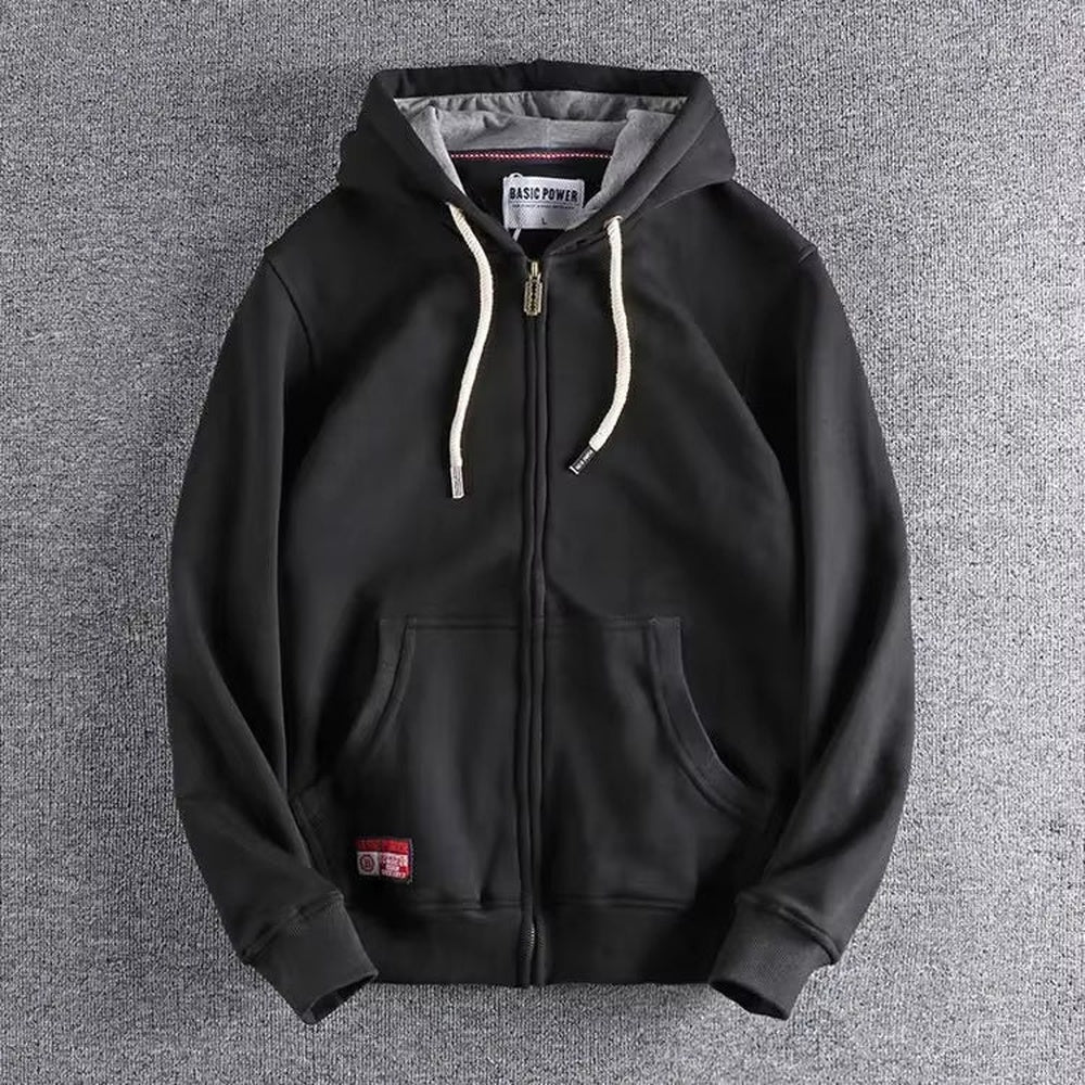 Zwarte hoodie met rits, grijs gevoerde capuchon en koorden in gebroken wit, plat neergelegd | Boutique Moda
