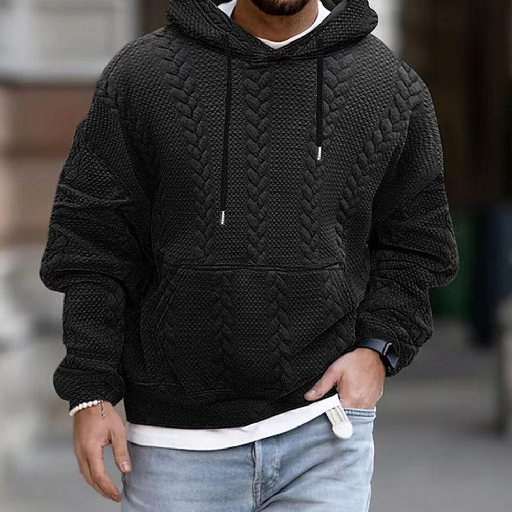 Gestructureerde hoodie voor heren in zwart, gedragen, voorkant