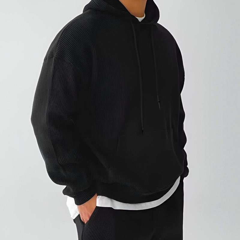 Geribde oversized hoodie voor heren in zwart, gedragen, zijkant
