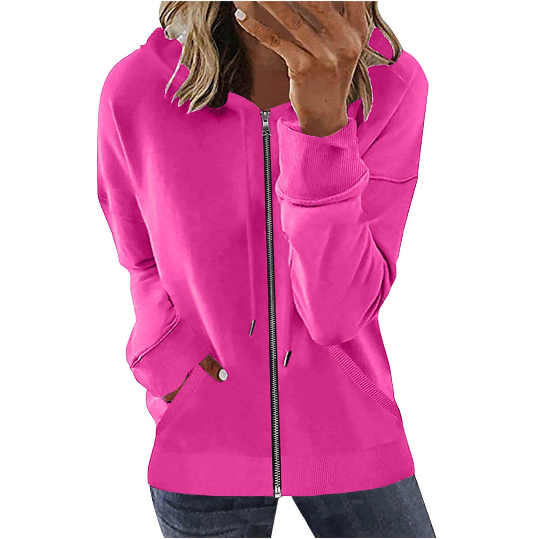 Vrouw in een fuchsia sweatvest met doorlopende rits en een jeans | Boutique Moda