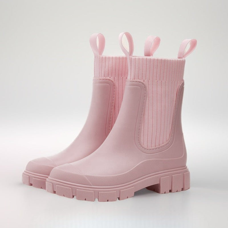 Halfhoge regenlaarzen met gebreide sokschacht in roze, productfoto