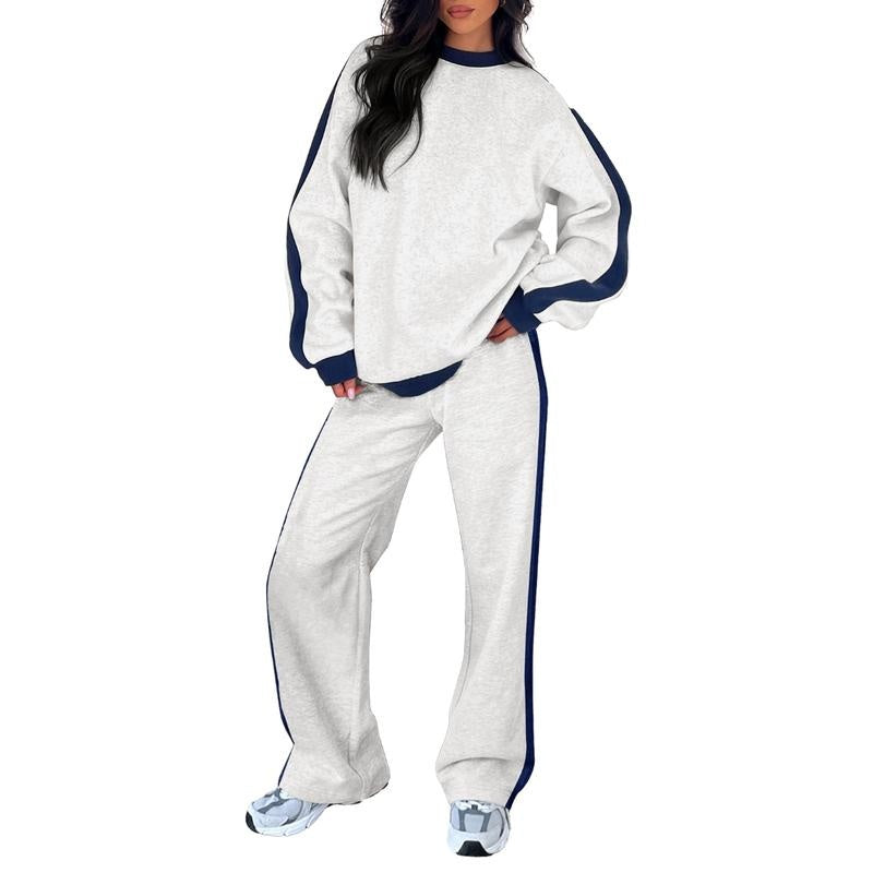 Joggingpak met zijstreep, sweater en rechte broek in lichtgrijs, gedragen, vooraanzicht
