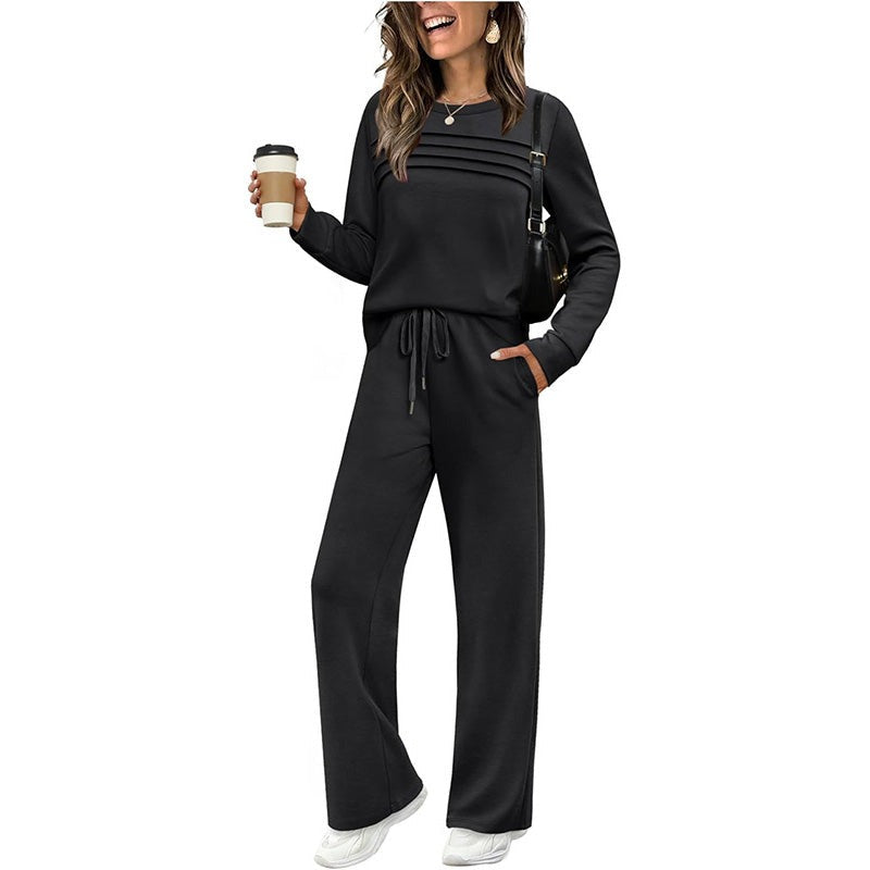 Zwart joggingset met longsleeve en wijde broek, gedragen door vrouw | Boutique Moda