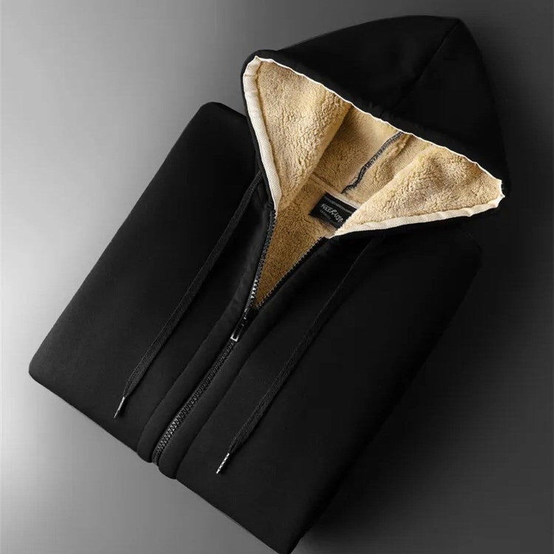 Zwart vest opgevouwen, met zicht op de pluizige teddyvoering | Boutique Moda