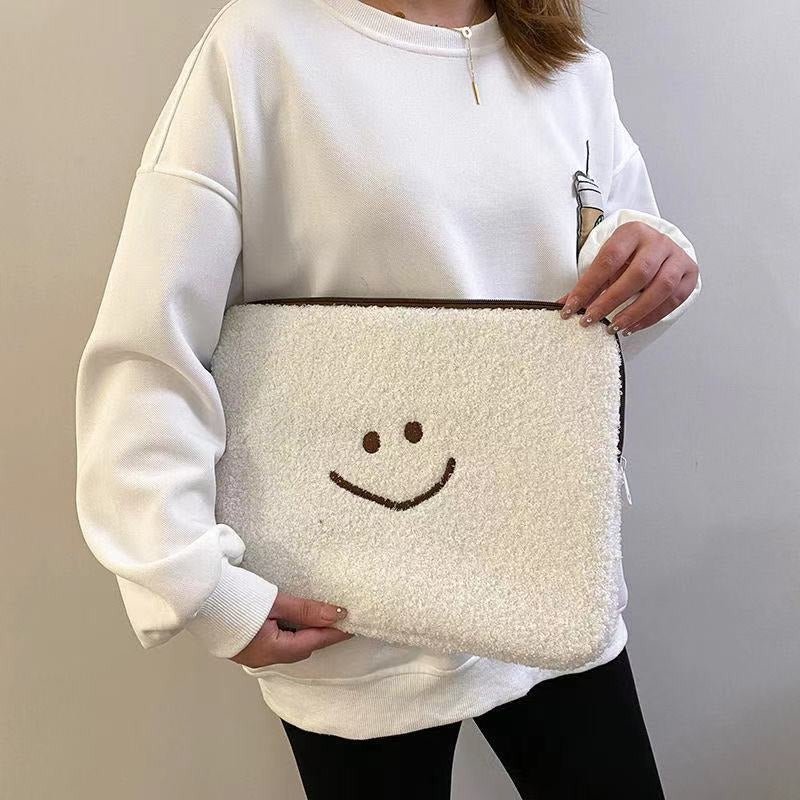 Laptophoes van teddystof met smiley 5