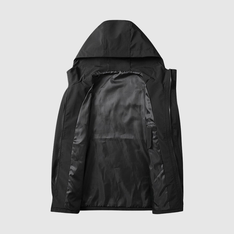Zwart windjack met capuchon, platliggend met geopende binnenvoering getoond | Boutique Moda