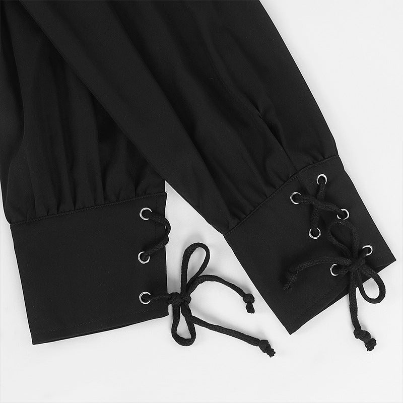 Zwarte mouw met vetersluiting en metalen ogen, close-up detail | Boutique Moda