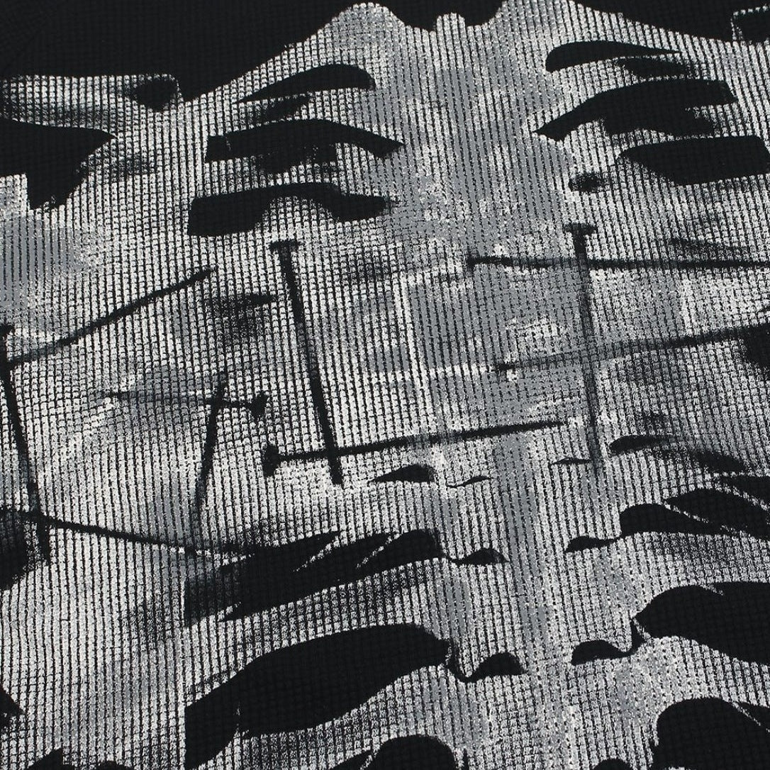 Close-up van zwart-wit geweven stof met abstracte rib- en röntgenachtige print | Boutique Moda
