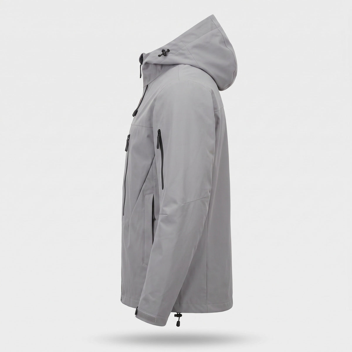 Grijze regenjas met capuchon en ritszakken, zijaanzicht op onzichtbare mannequin | Boutique Moda