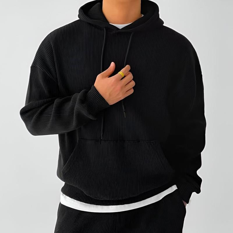 Geribde oversized hoodie voor heren in zwart, gedragen, voorkant