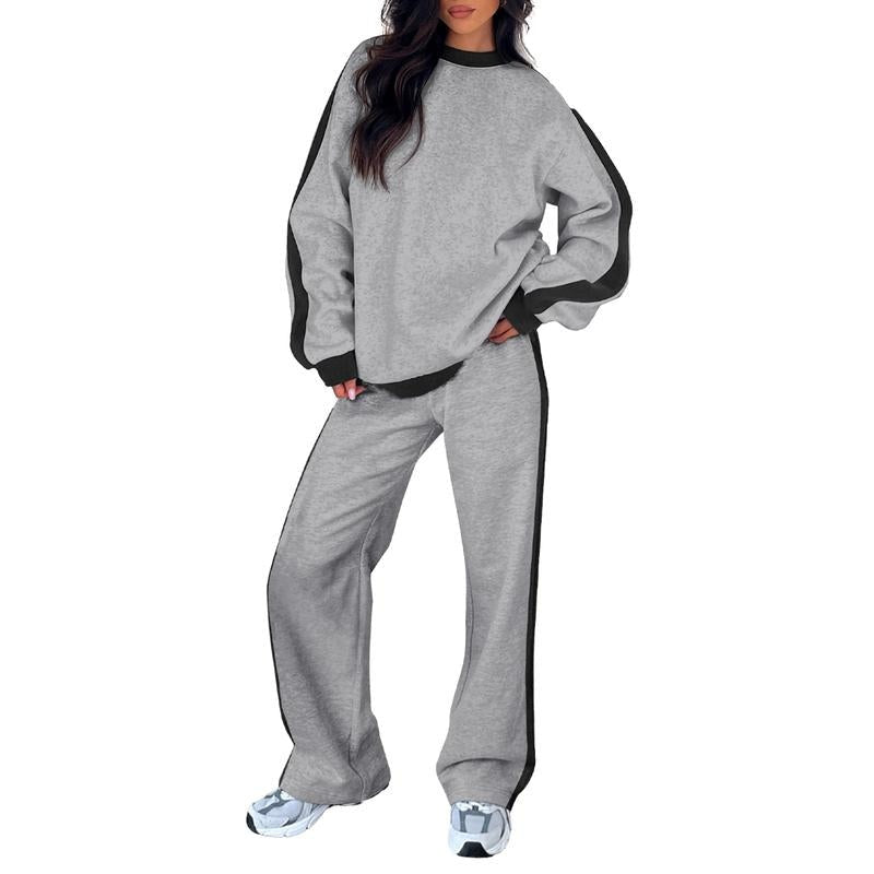 Joggingpak met zijstreep, sweater en rechte broek in grijs, gedragen, vooraanzicht
