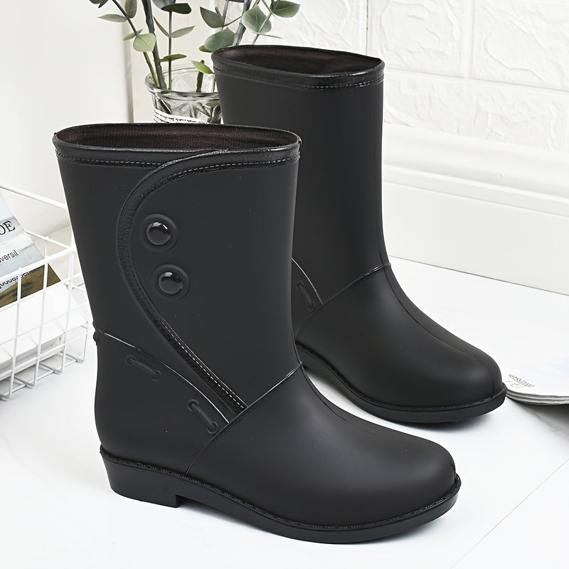 Halfhoge regenlaarzen met sierknopen in zwart, productfoto