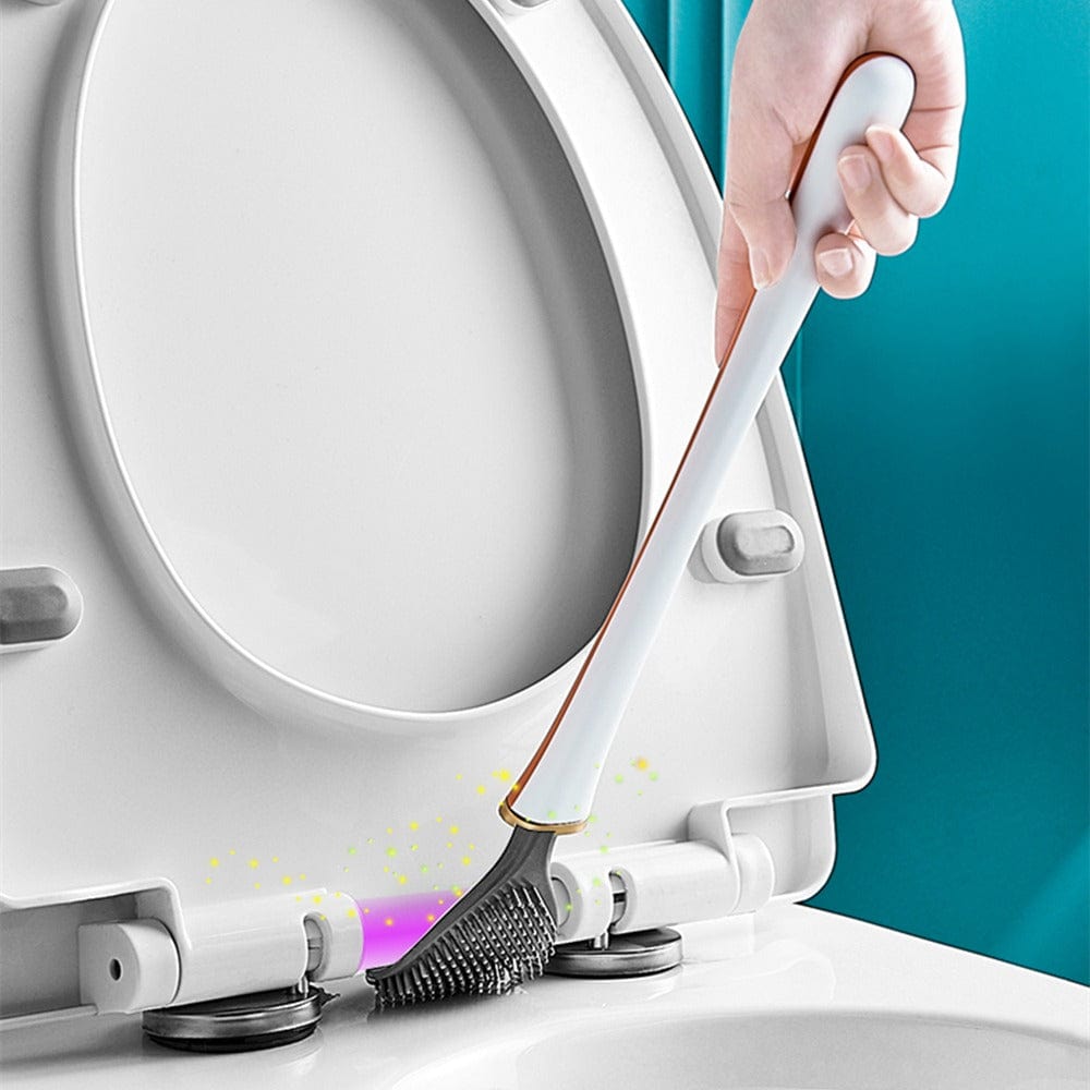 Witte siliconen wc-borstel met grijze kop, vastgehouden boven toiletbril | Boutique Moda