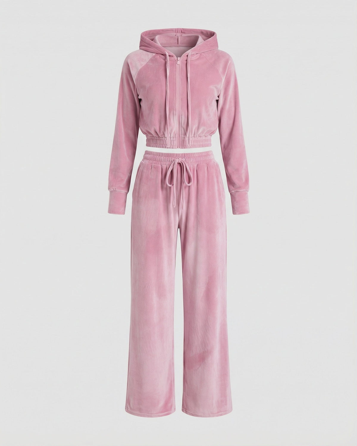 Velours huispak in roze met korte hoodie en wijde broek, liggend voorkant