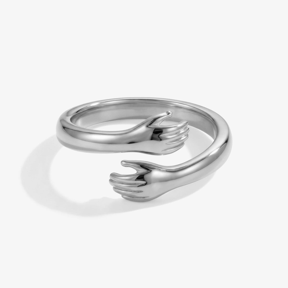 Zilveren knuffelring met handjes