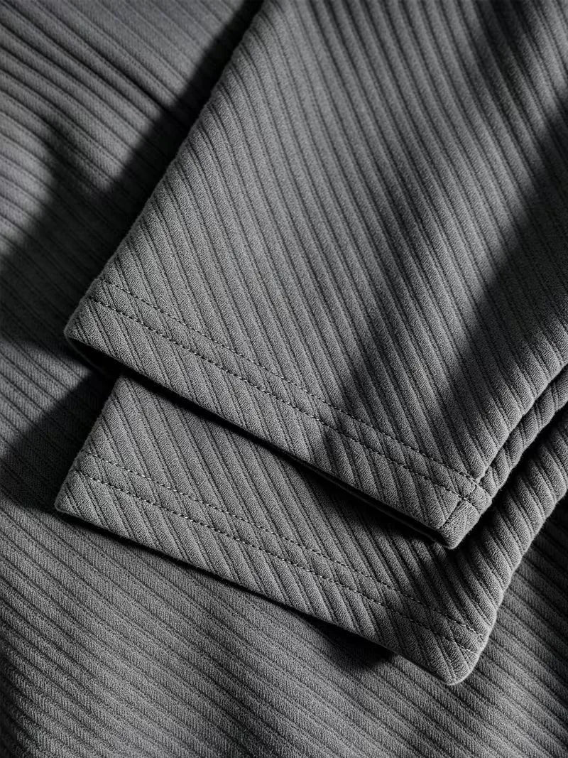 Heren blazer met gebreide structuur in antraciet, close-up van de mouw