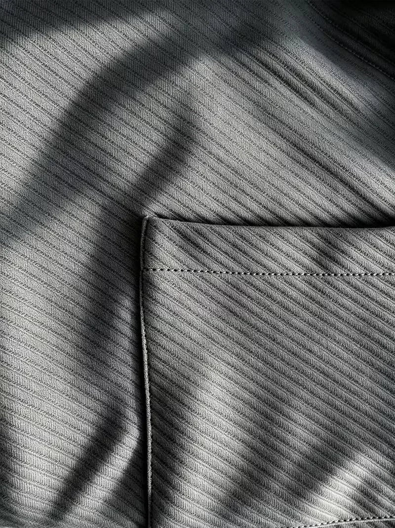 Heren blazer met gebreide structuur in antraciet, close-up van de zak