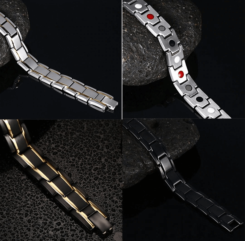 Vier metalen armbanden in zilver, zwart en goud, plat gefotografeerd op steen | Boutique Moda