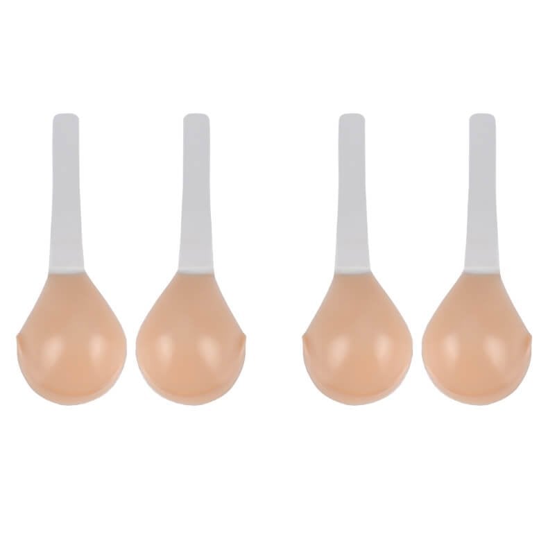 Vier huidkleurige siliconen plak BH cups met witte bandjes, plat liggend | Boutique Moda