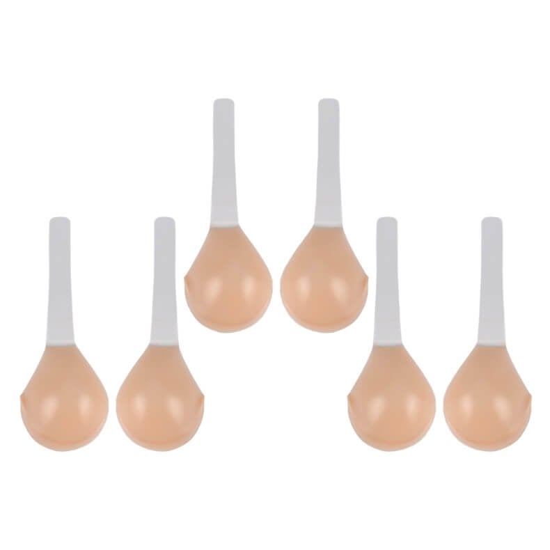 Zes beige siliconen plak BH cups met witte bandjes, plat neergelegd | Boutique Moda