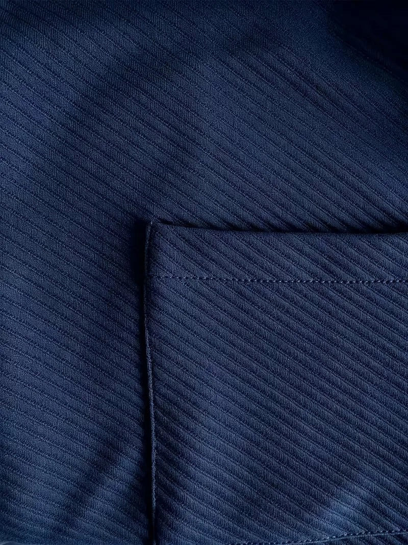 Heren blazer met gebreide structuur in marineblauw, close-up van de zak