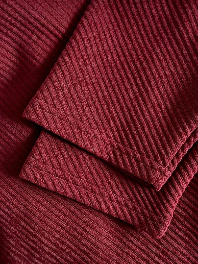 Heren blazer met gebreide structuur in bordeaux, close-up van de mouw