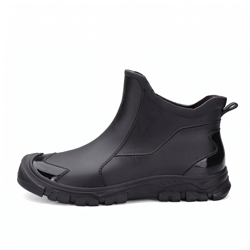 A black ankle rain boot shown from the side against a white background.