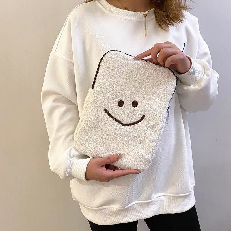 Laptophoes van teddystof met smiley 2