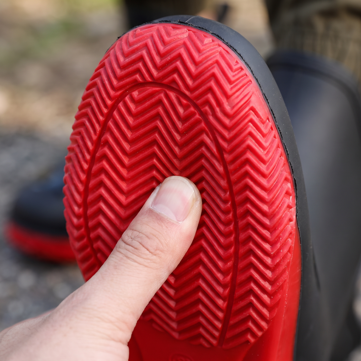Close-up van de rode zool met visgraatprofiel
