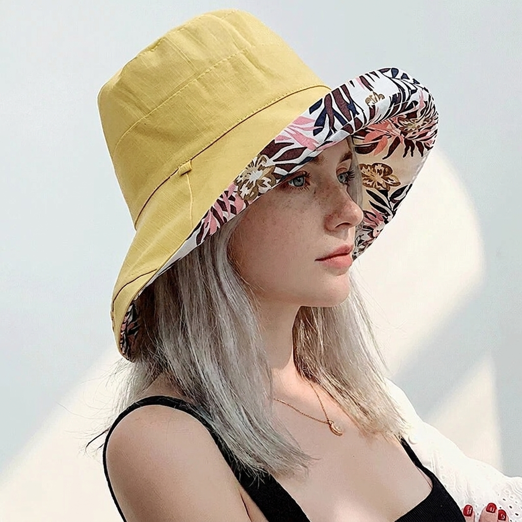 Zonnehoed dames in geel gedragen in de zon - Boutique Moda