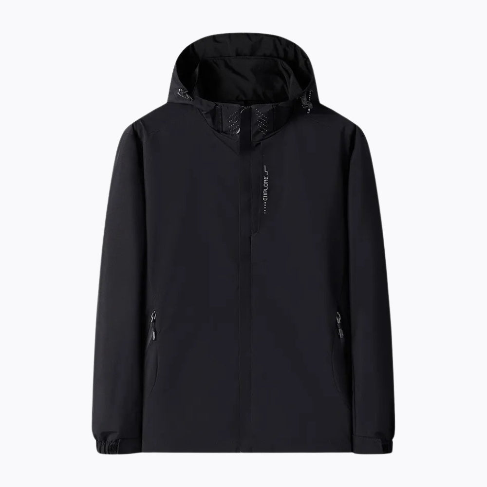 Zwarte wandeljas met capuchon, platliggend getoond, ritszakken zichtbaar | Boutique Moda