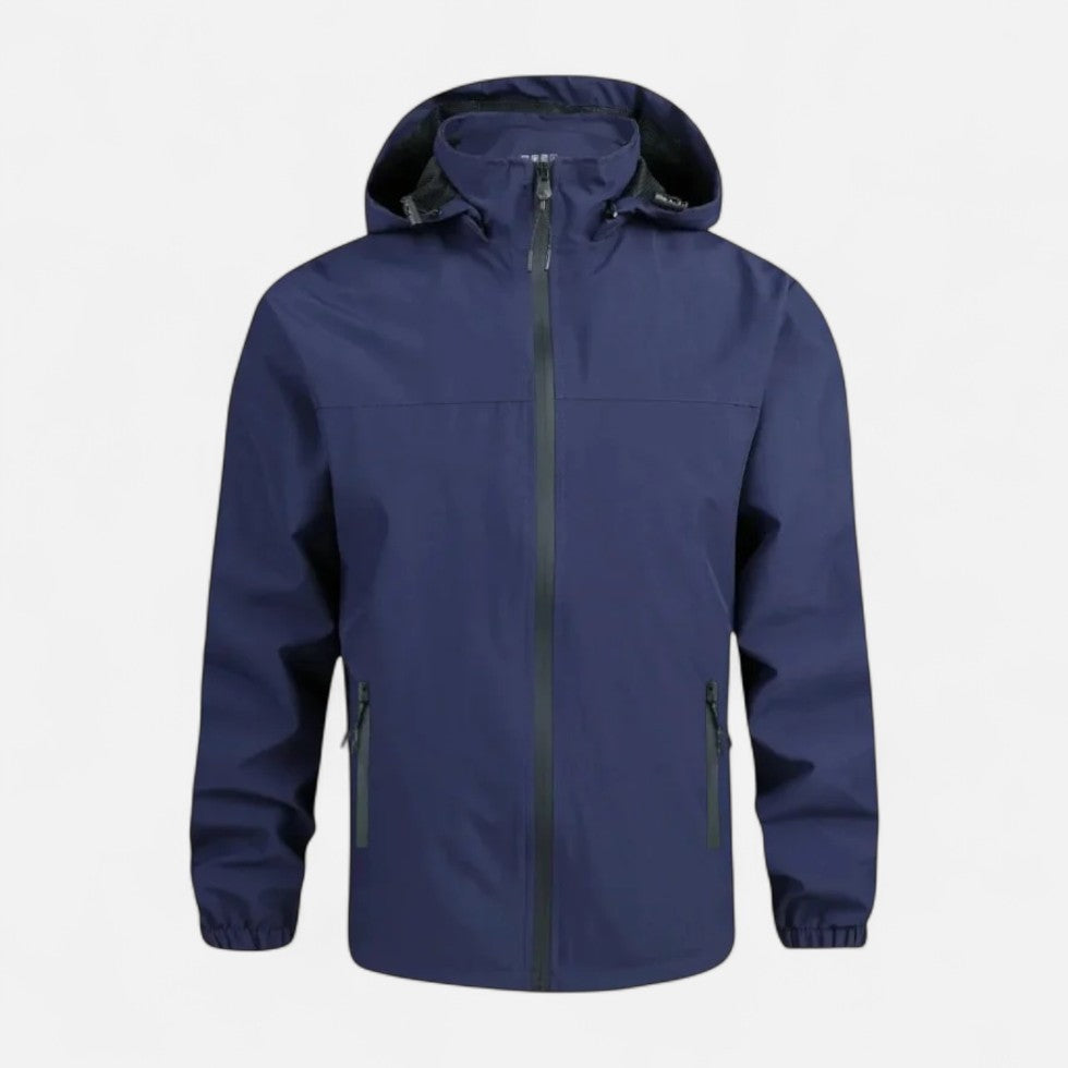 Marineblauwe windbreaker jas met capuchon, ritszakken, plat gefotografeerd op lichte achtergrond | Boutique Moda