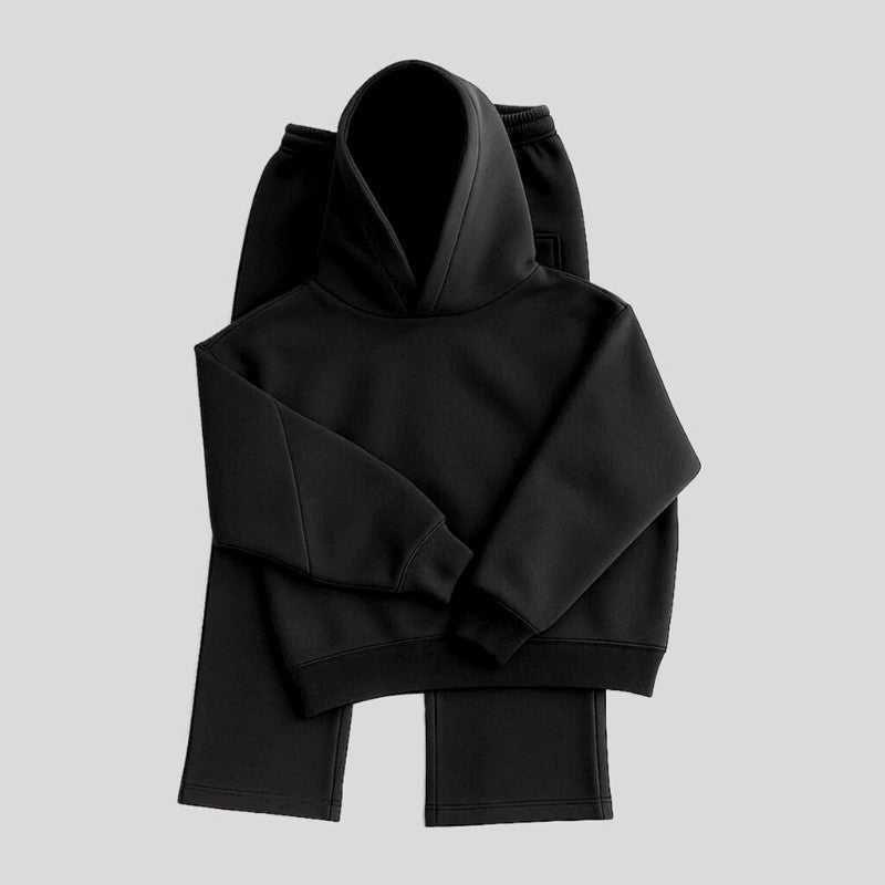 Zwarte hoodie en joggingbroek plat neergelegd, effen kleur, geen opdruk | Boutique Moda