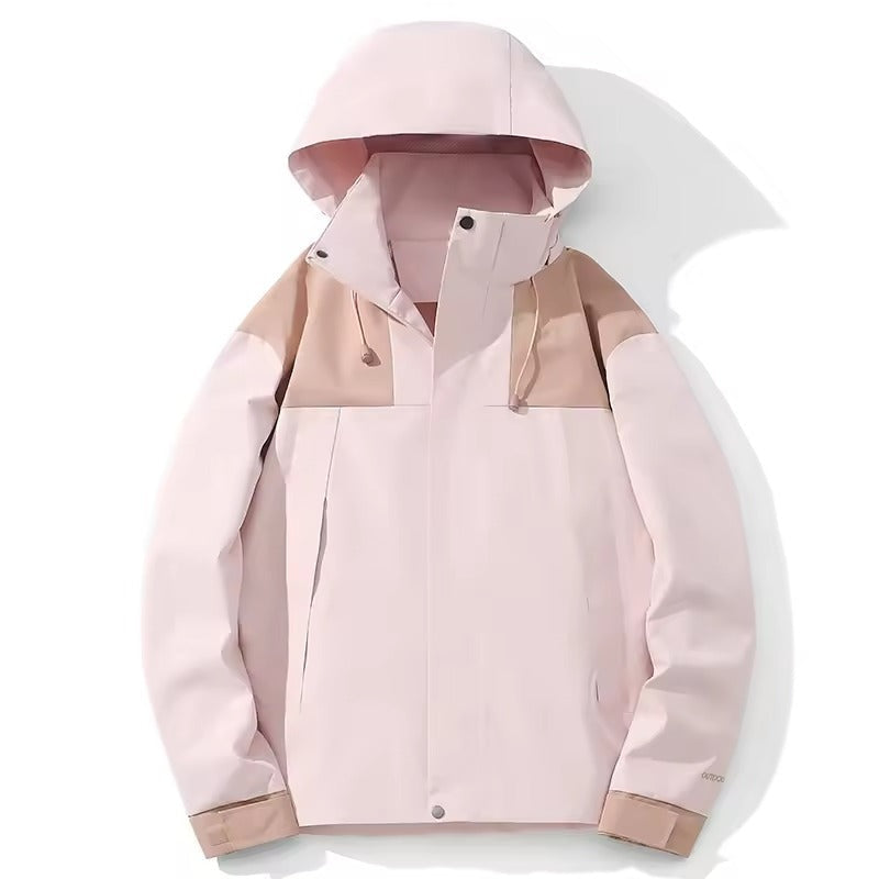 Roze outdoorjas met capuchon, kleurblokpatroon, opgehangen zonder model | Boutique Moda