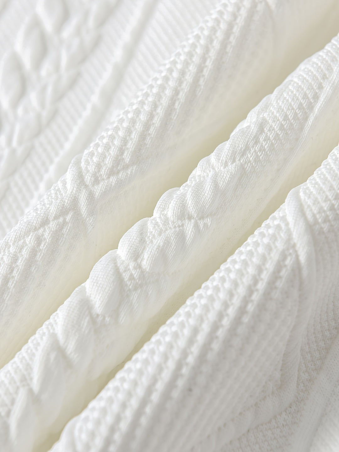 Close-up van het kabel- en ruitpatroon in reliëf | Boutique Moda