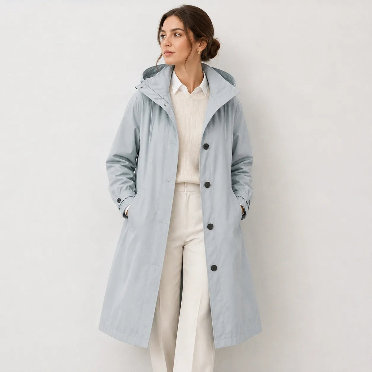 Lange regenjas in blauwgrijs met capuchon en knoopsluiting | Boutique Moda