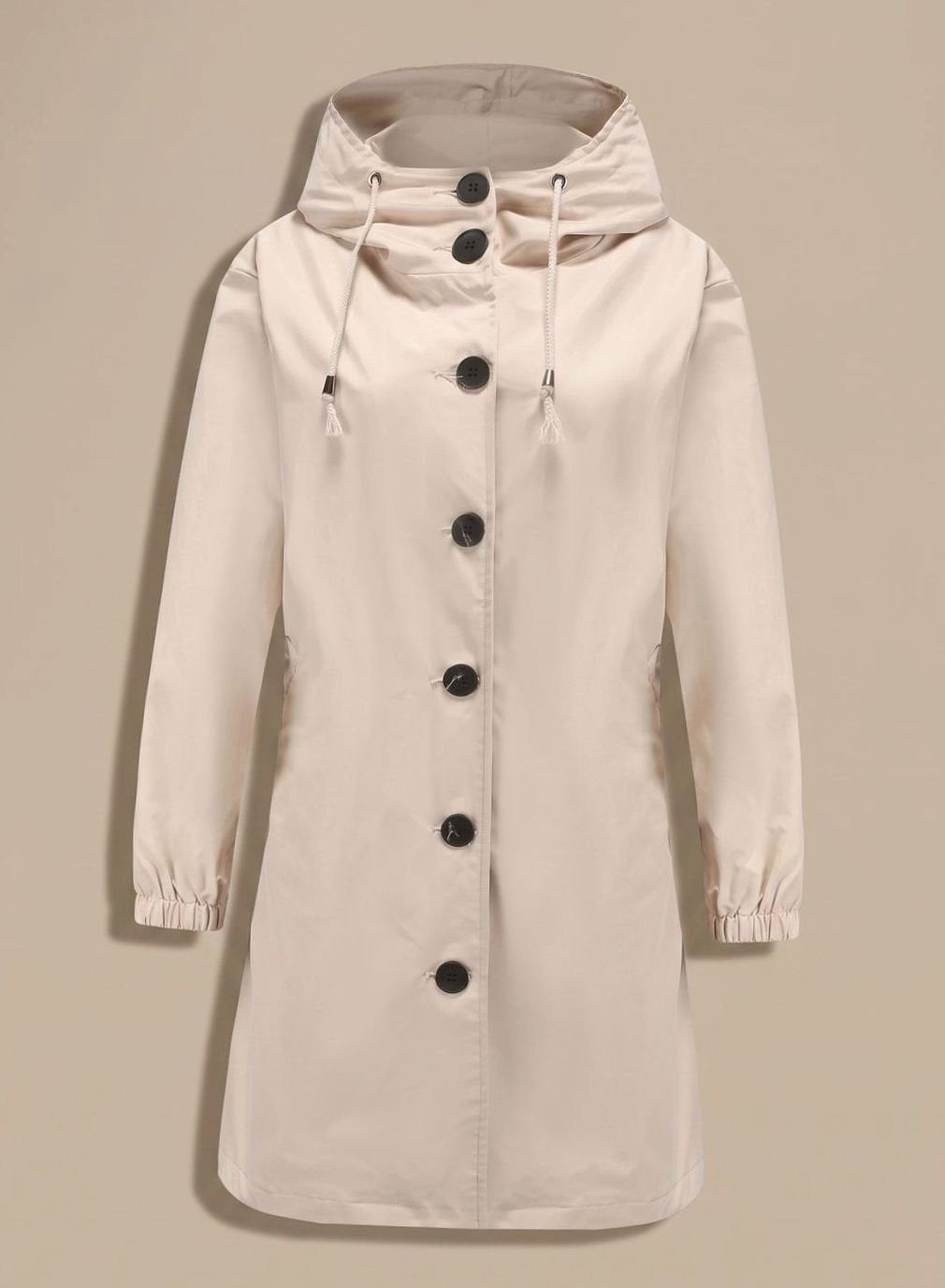 Lange trenchcoat in beige met capuchon en knoopsluiting | Boutique Moda