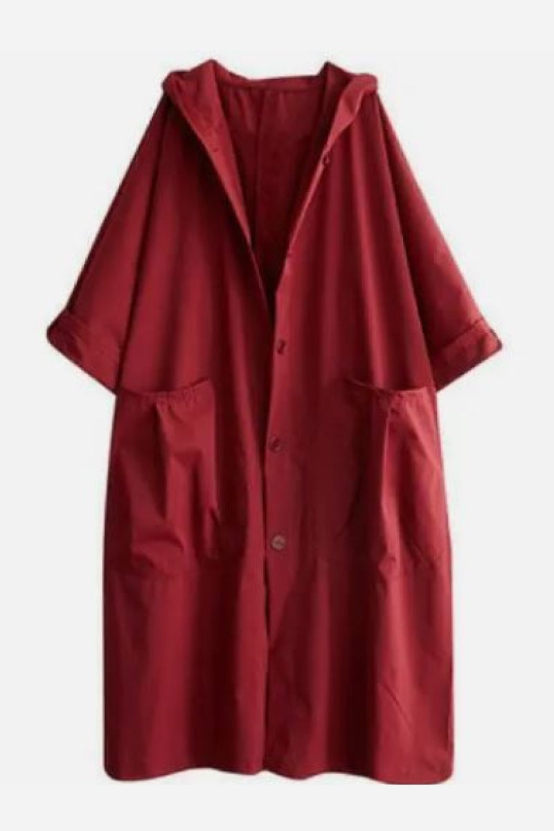Rode oversized jas met capuchon, plat neergelegd | Boutique Moda