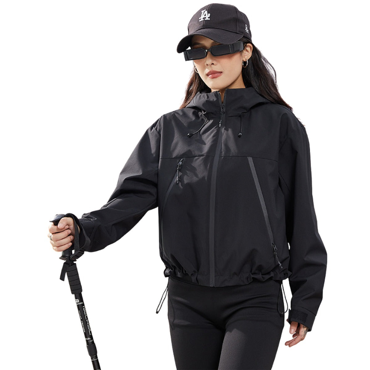 Zwarte regenjas met wandelstokken | Boutique Moda