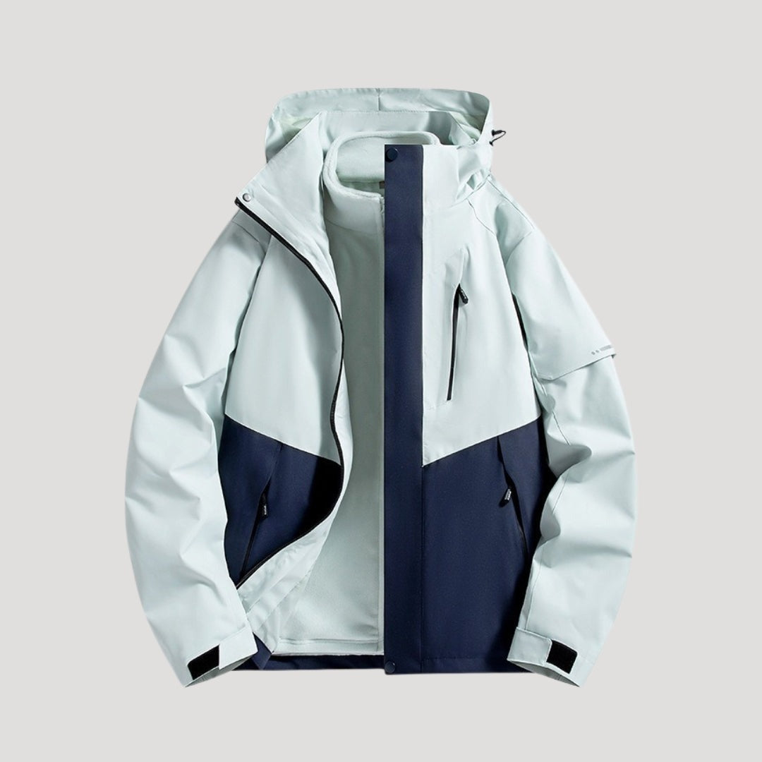 Outdoorjas in ijsblauw, waterdicht, met capuchon, tweekleurige panelen en ritszakken | Boutique Moda