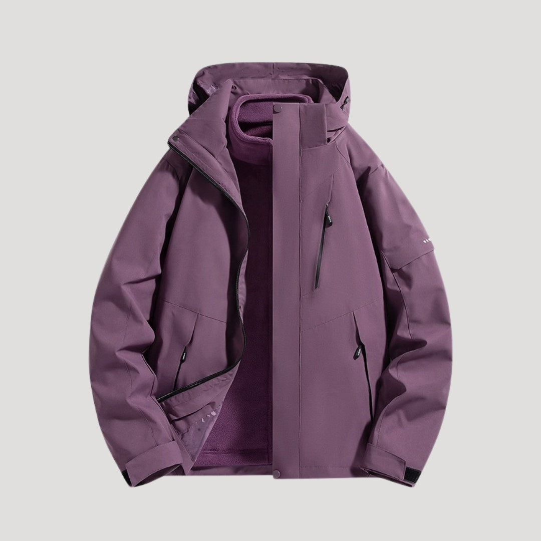 Outdoorjas in paars, waterdicht, met capuchon, tweekleurige panelen en ritszakken | Boutique Moda
