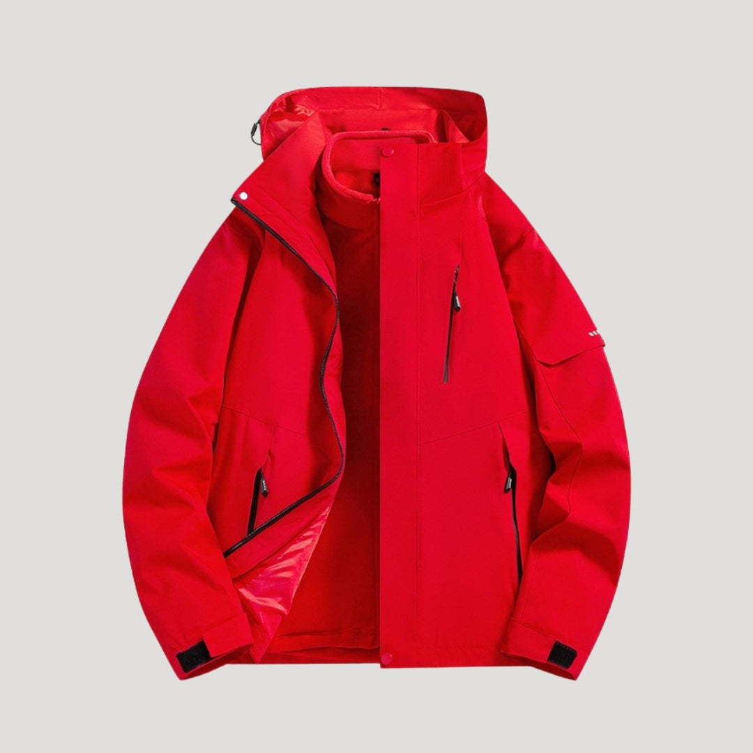 Outdoorjas in rood, waterdicht, met capuchon, tweekleurige panelen en ritszakken | Boutique Moda