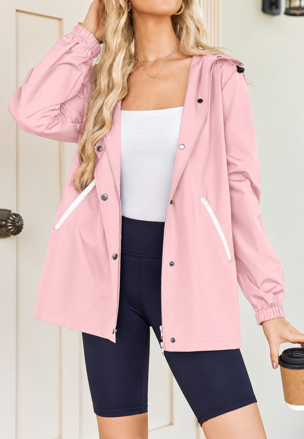Roze regenjas met schuine ritszakken | Boutique Moda