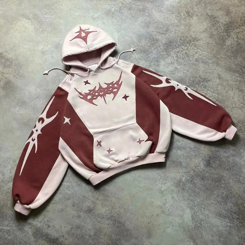 Tweekleurige hoodie in rood en roze met sterrenpatchwork | Boutique Moda