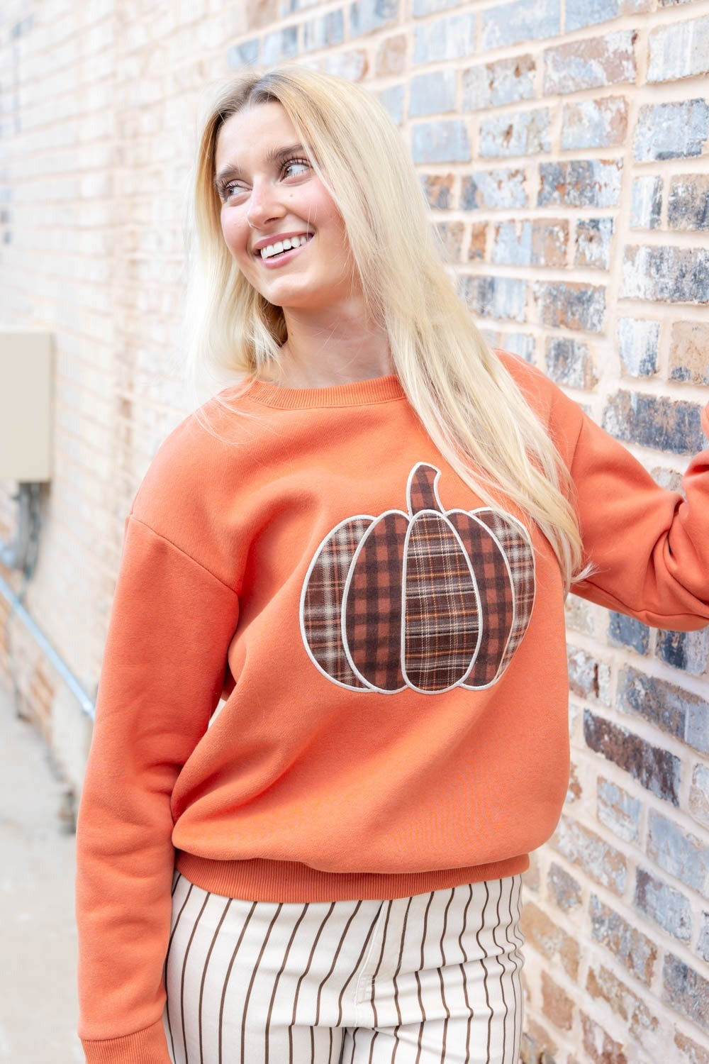 Oranje pompoensweater, voorkant