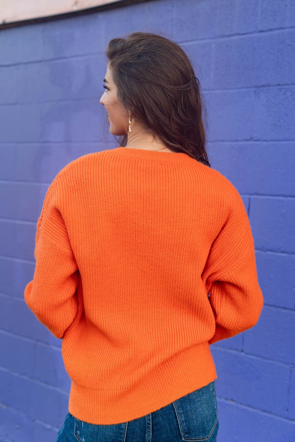 Oranje ribgebreide trui, achterkant