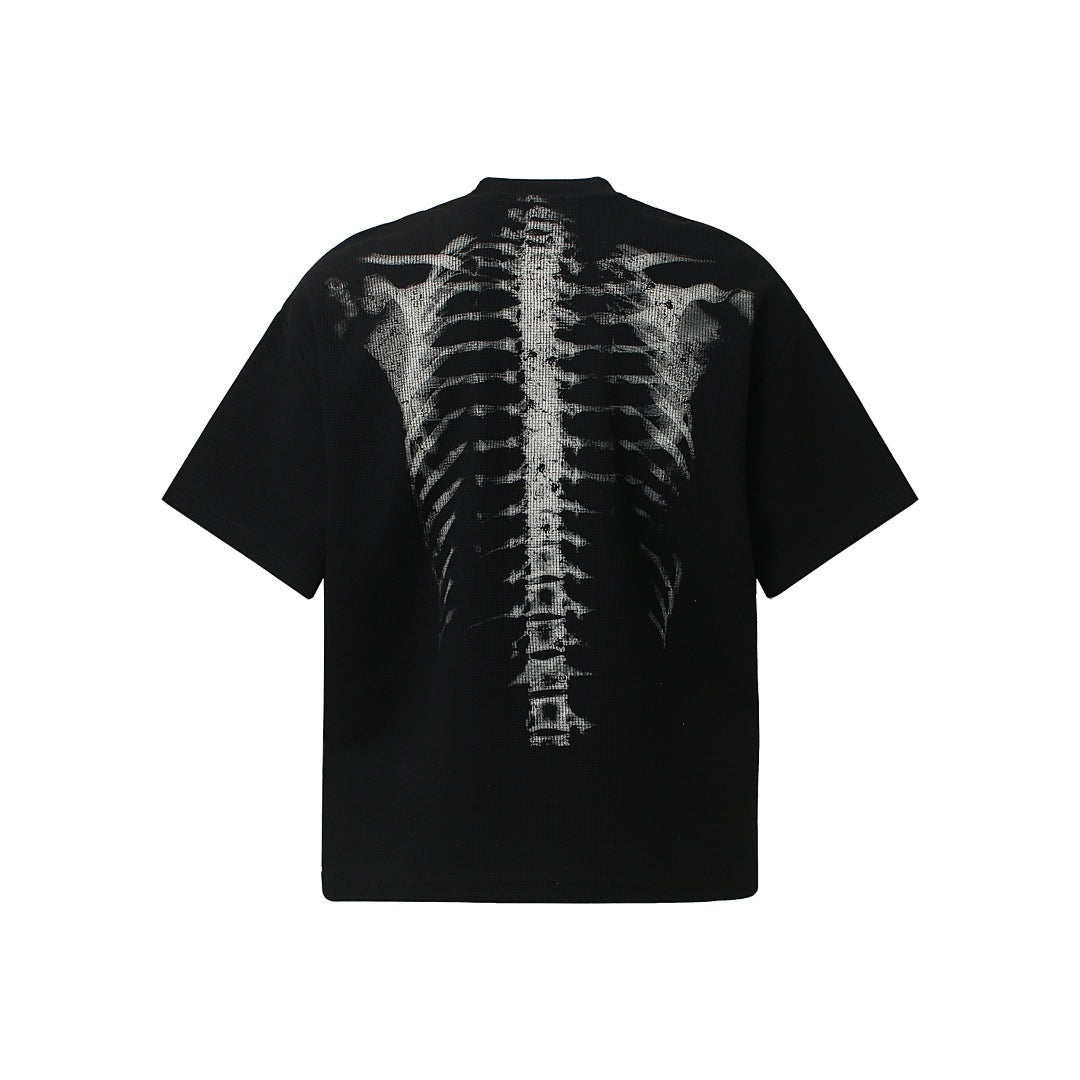 Zwart oversized T-shirt met wit skeletprint op de rug, plat weergegeven | Boutique Moda
