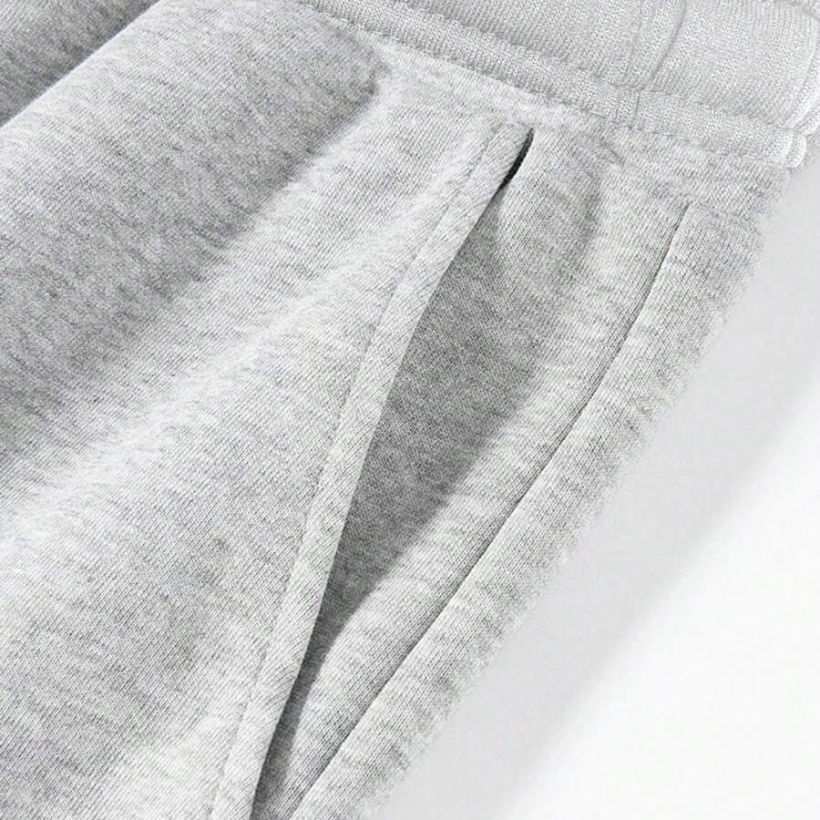 Grijze joggingbroek met zak en elastische taille, close-up detailfoto | Boutique Moda