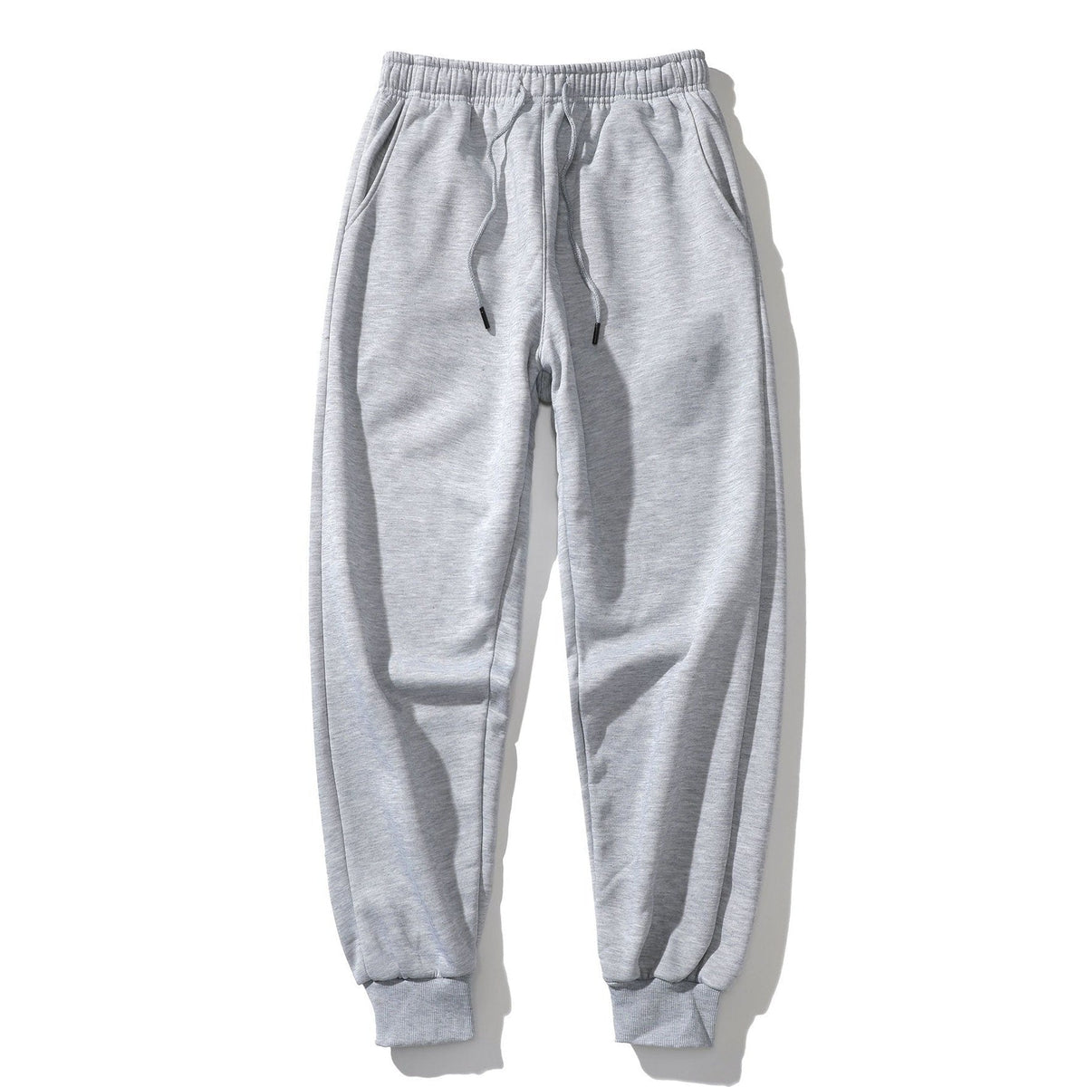 Grijze joggingbroek met boord, platgelegd getoond, geen model zichtbaar | Boutique Moda